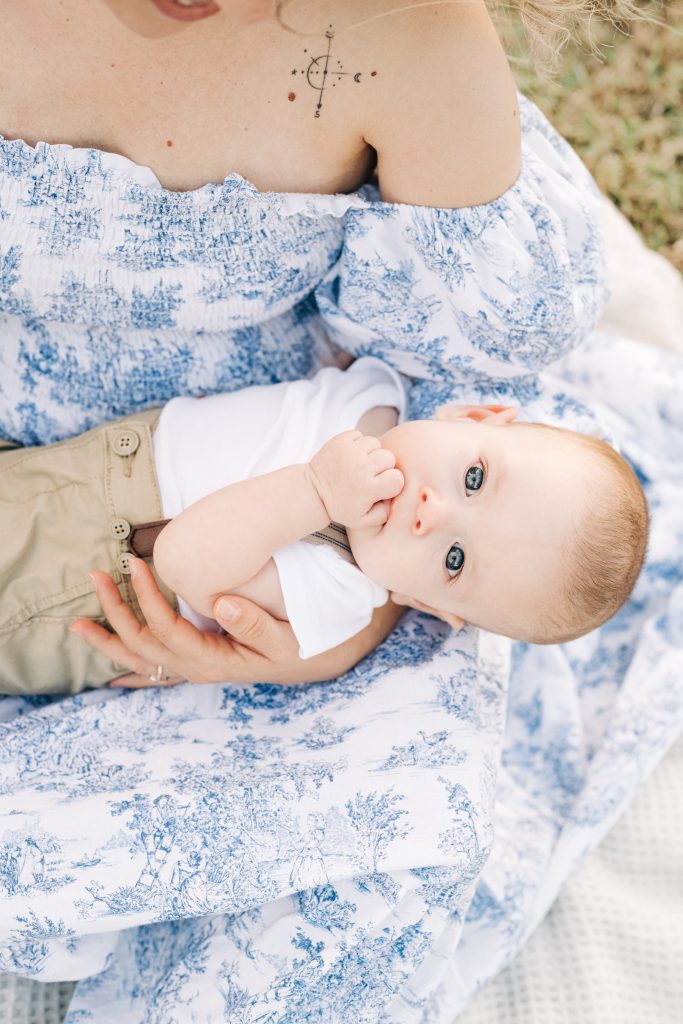 baby laying on mom's lap during boca raton milestone session