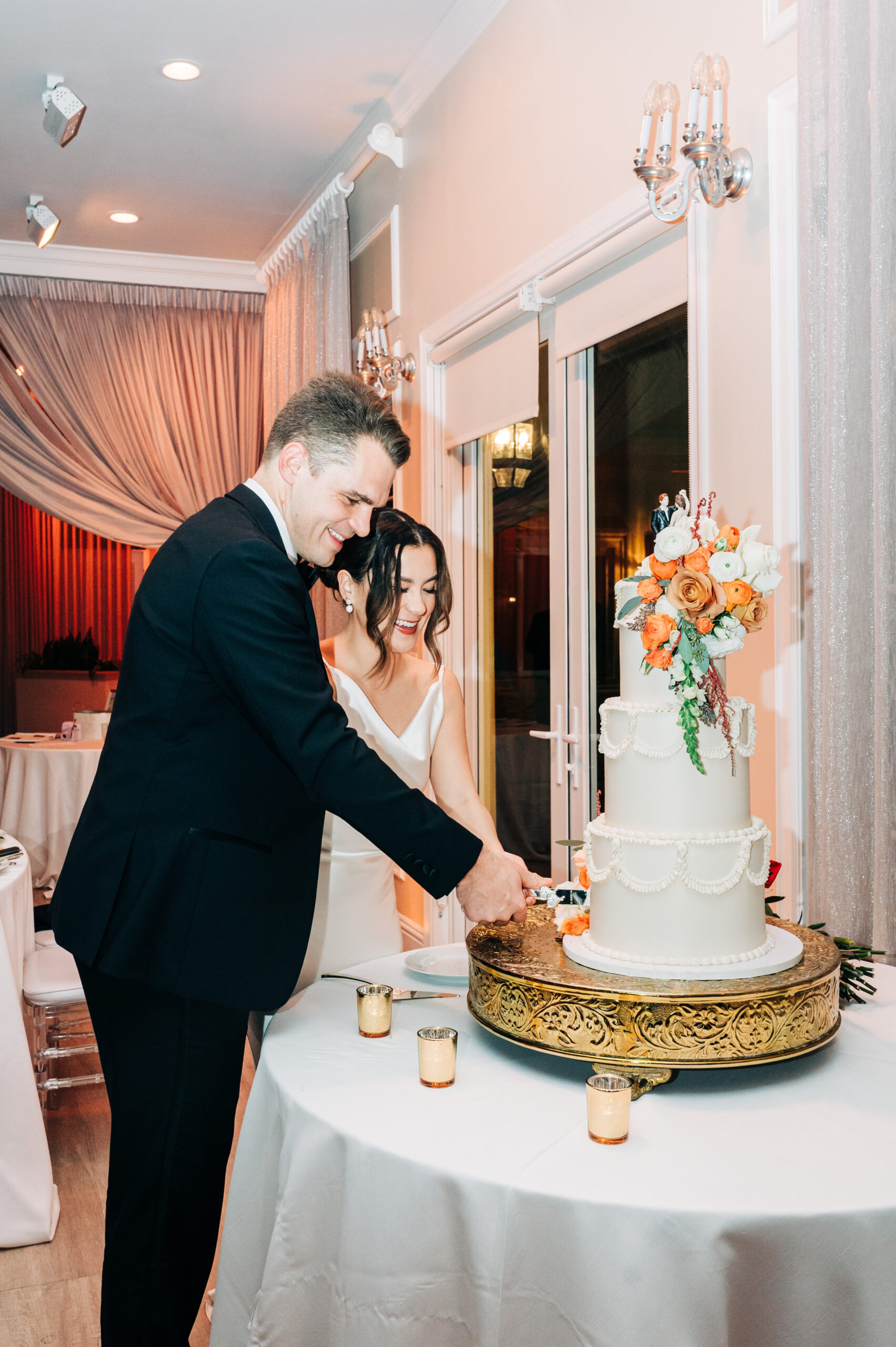 Bride and groom cutting their wedding cake at Benvenuto in Boynton Beach